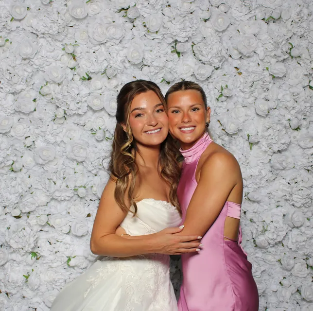 Guests at the white rose flower wall