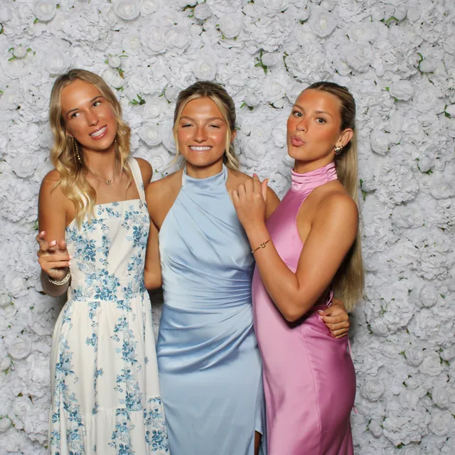 Guests at the white rose flower wall
