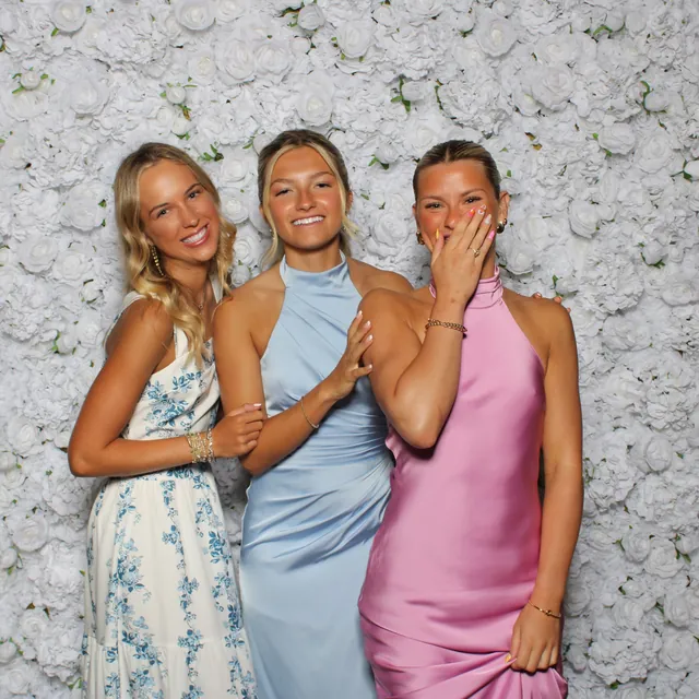 Guests at the white rose flower wall