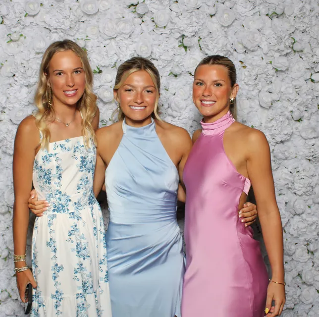 Guests at the white rose flower wall