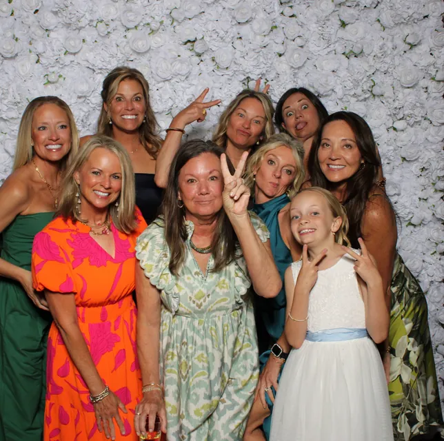 Guests at the white rose flower wall