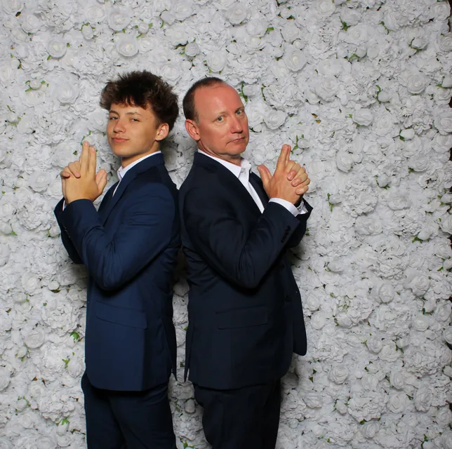 Guests at the white rose flower wall