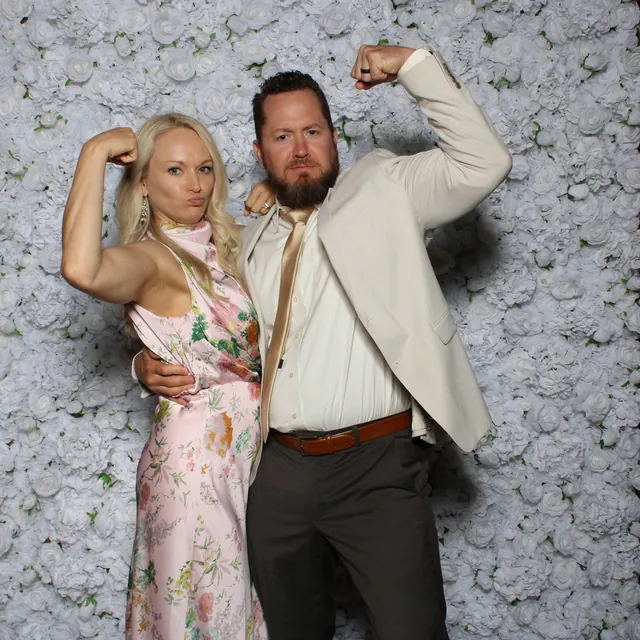 Guests at the white rose flower wall