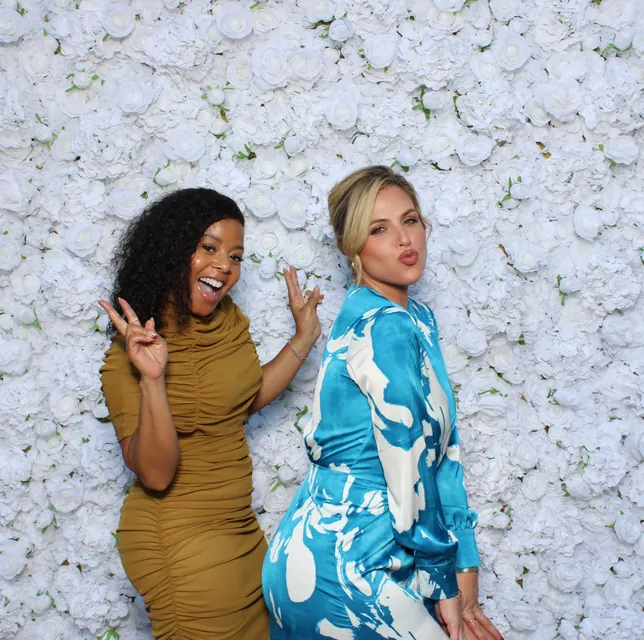 Guests at the white rose flower wall