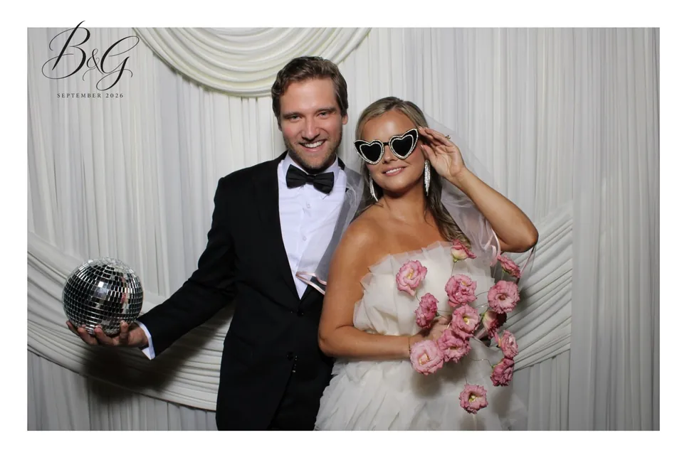 Bride and groom with a disco ball and heart sunglasses